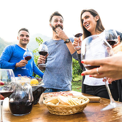 Friends enjoying wine at winery